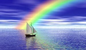 a-sailboat-sailing-toward-a-vibrant-rainbow 